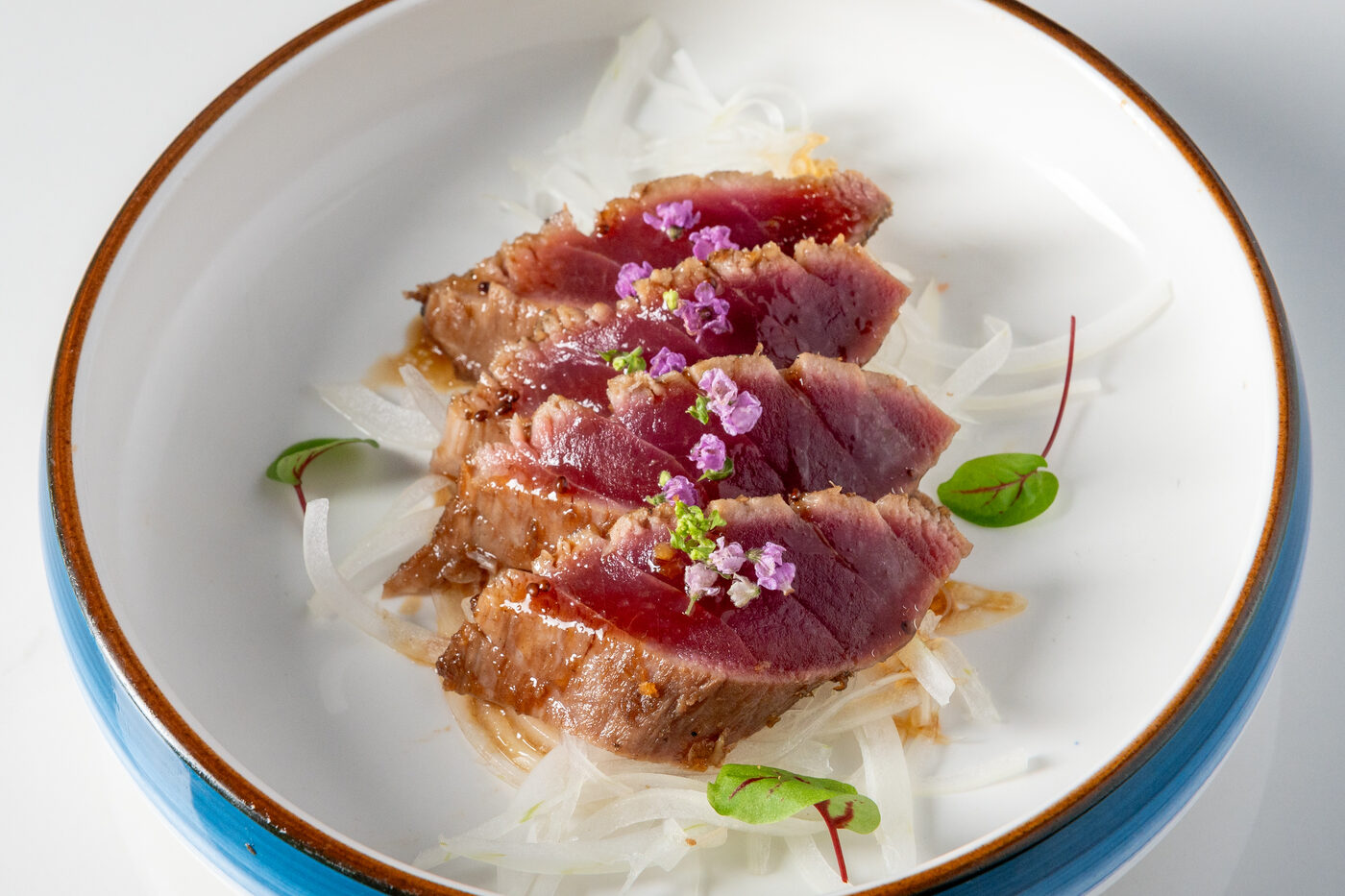 Ahi Tuna Tataki seared and thinly sliced - East Moon Asian Bistro Centennial CO