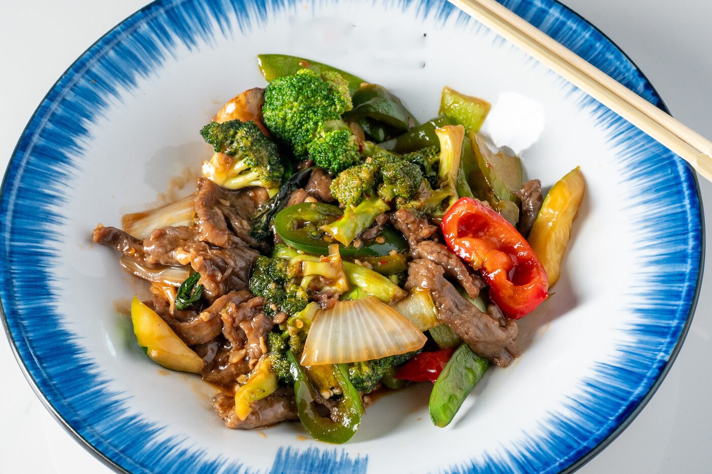 Basil Beef with broccoli and bell peppers - East Moon Asian Bistro Centennial