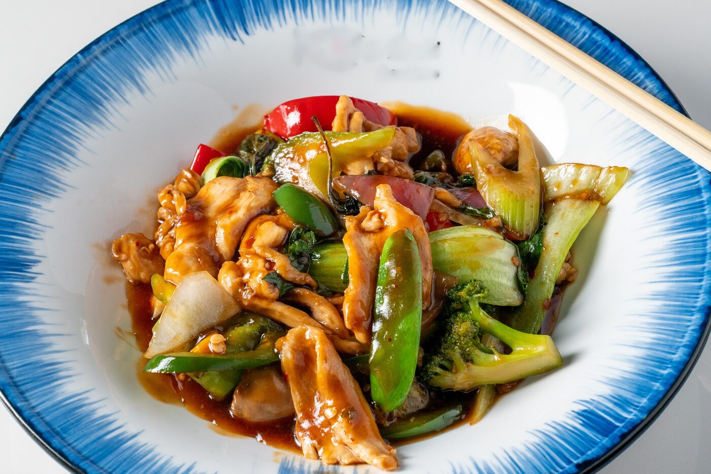 Basil Chicken stir-fried with fresh Thai basil and vegetables - East Moon Centennial CO