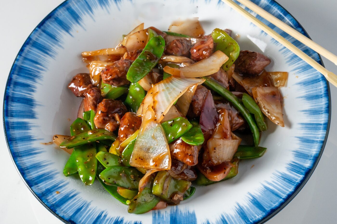 Black Pepper Beef Tenderloin with onions and peppers - East Moon Asian Bistro Centennial