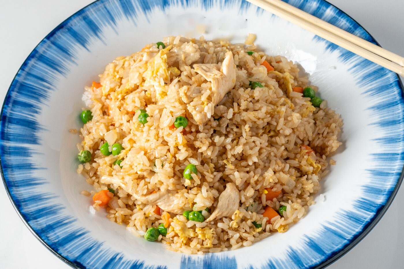 Chicken Fried Rice wok-fired with egg, peas and carrots - East Moon Centennial CO