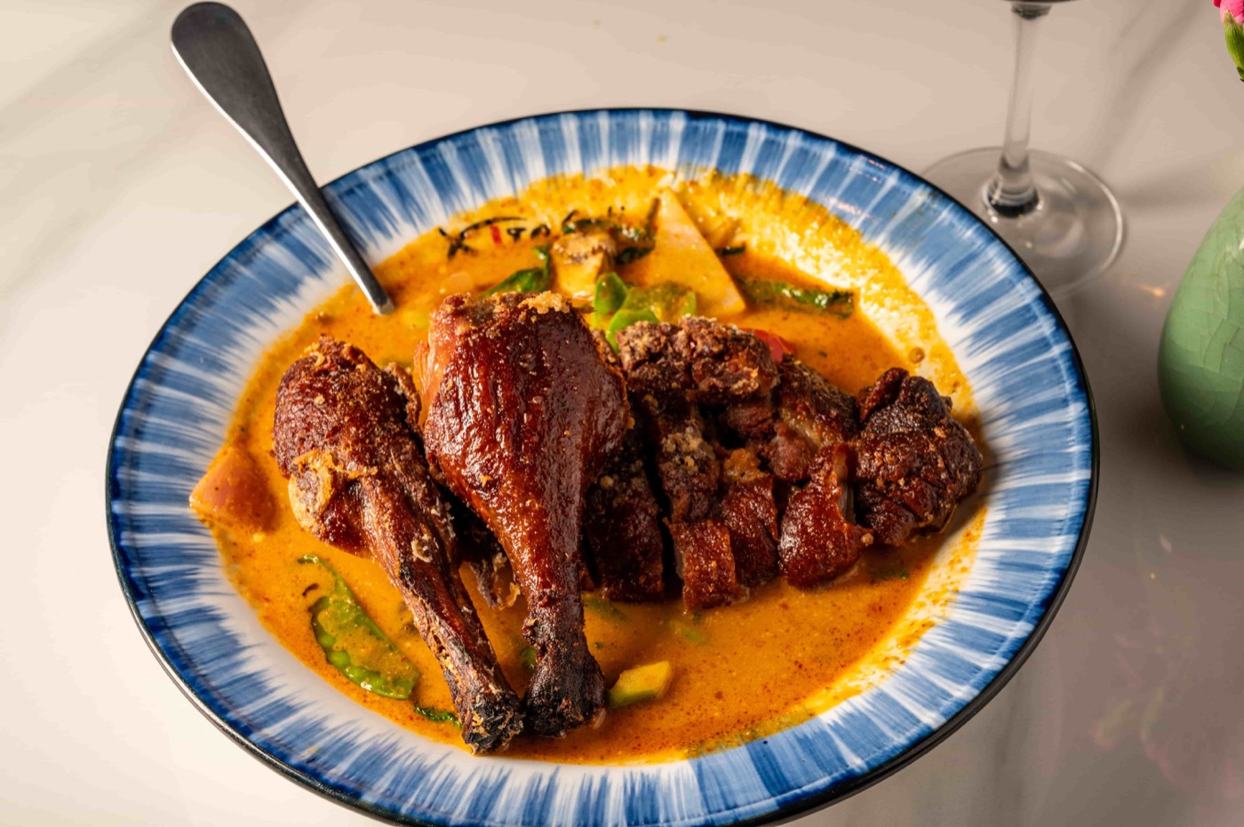 Bangkok Duck half roast duck simmered in Thai red curry - East Moon Asian Bistro Centennial CO