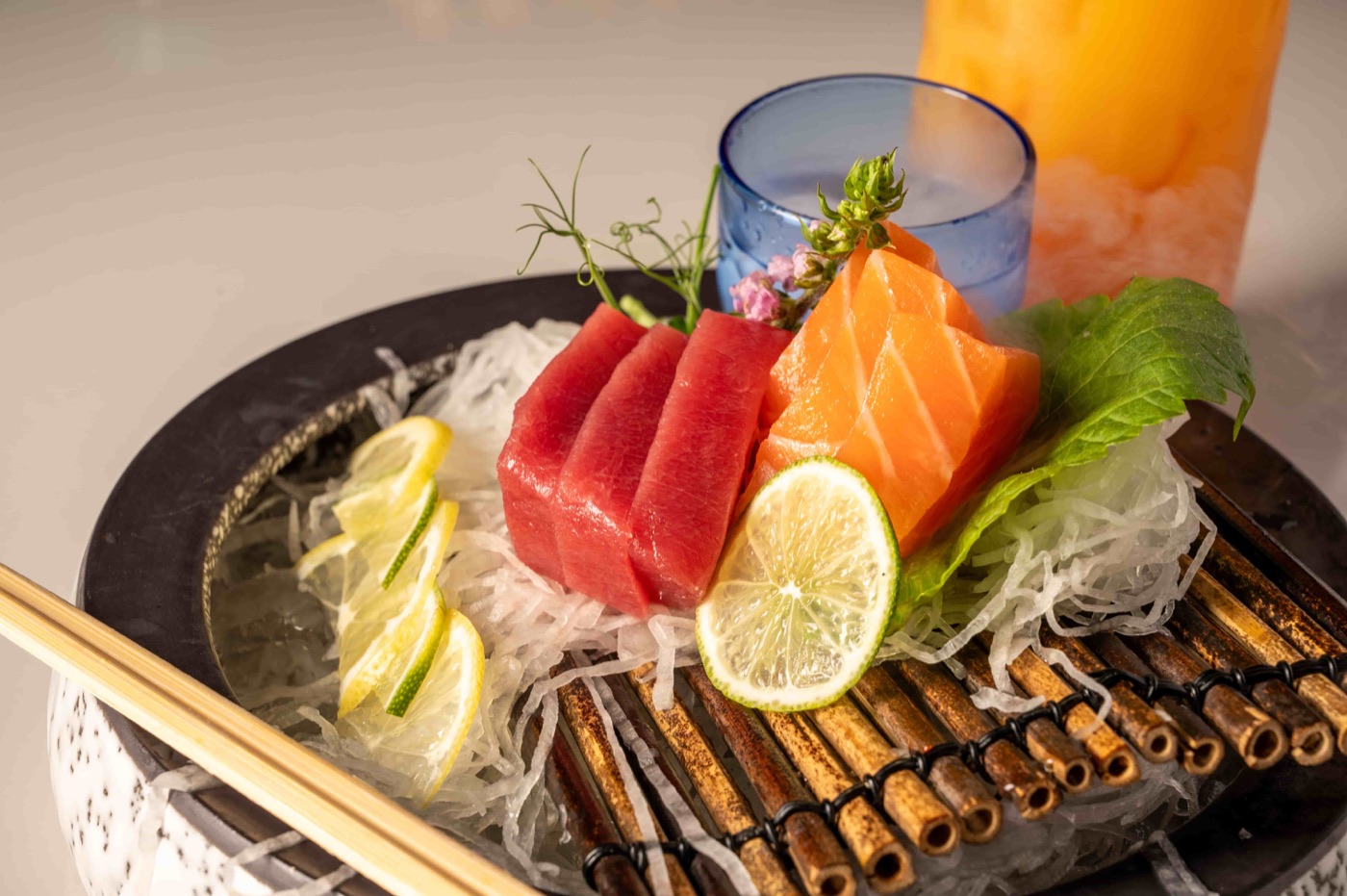 Sashimi appetizer with fresh tuna and salmon sliced over shaved daikon - East Moon Asian Bistro Centennial CO