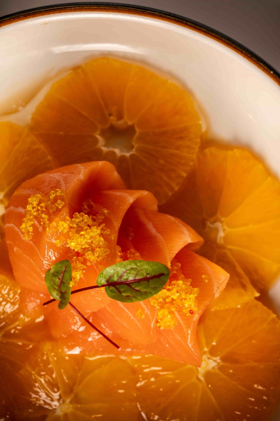 Truffle Orange Salmon sashimi with yuzu tobiko, fresh orange and ponzu sauce - East Moon Centennial CO